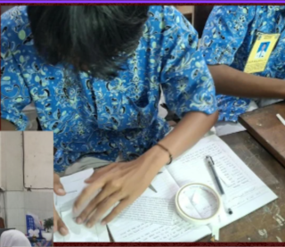 Student completing a classroom assessment